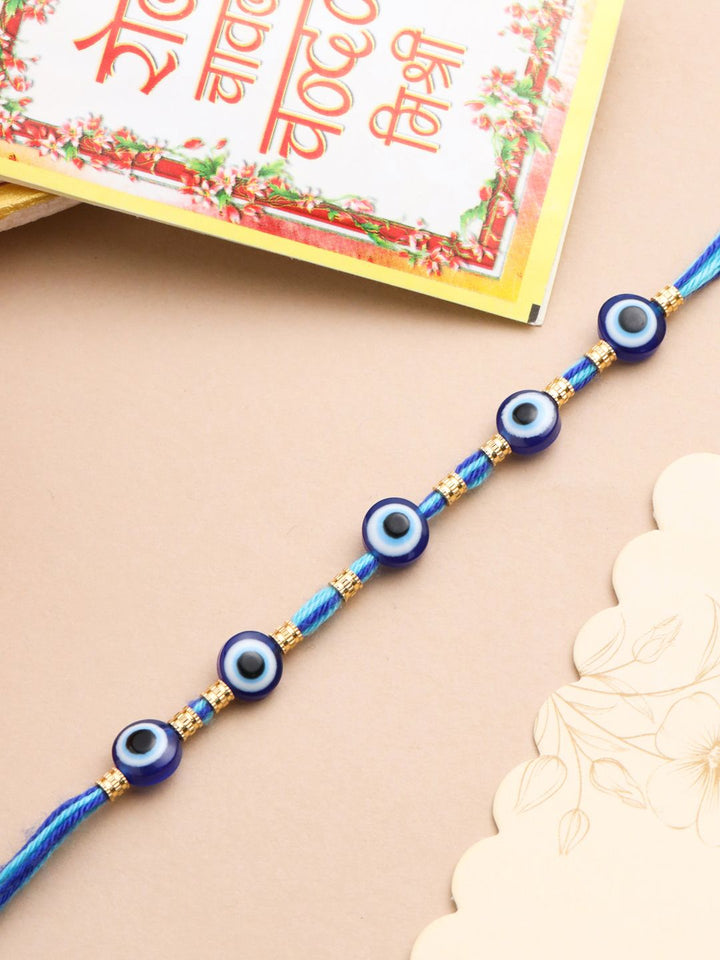 NVR Unisex Blue Evil Eye Thread Rakhi with Roli Chawal Chandan Mishri