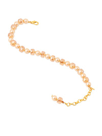 NVR Women Gold Toned Artificial Beads Wraparound Rakhi with Roli Chawal Chandan & Mishri