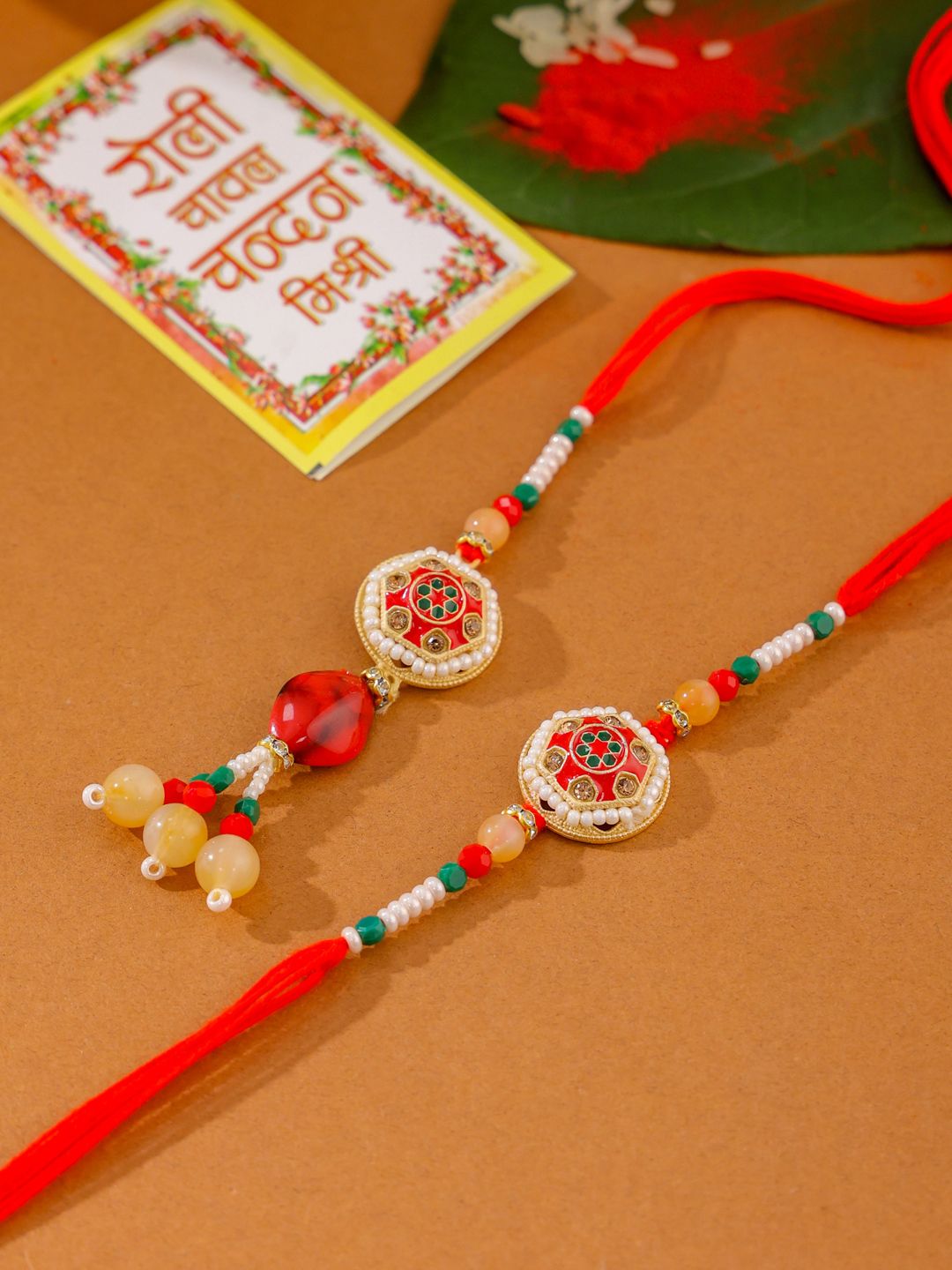 NVR Set of 2 Red Artificial Stones and Beads Bhaiya Bhabhi Rakhi with Roli Chawal
