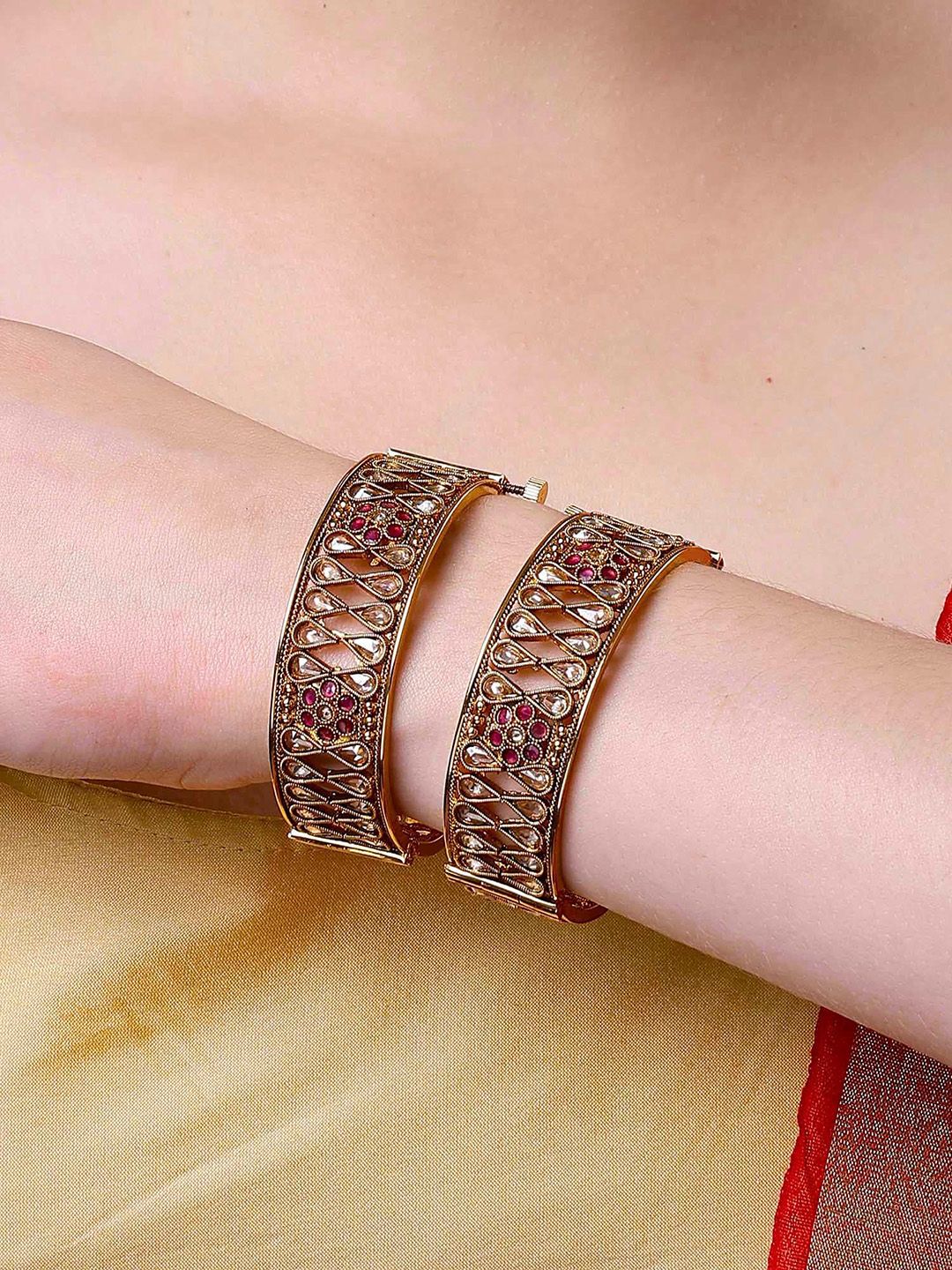 KARATCART Set of 2 Gold Plated Kundan Studded Antique Bangles