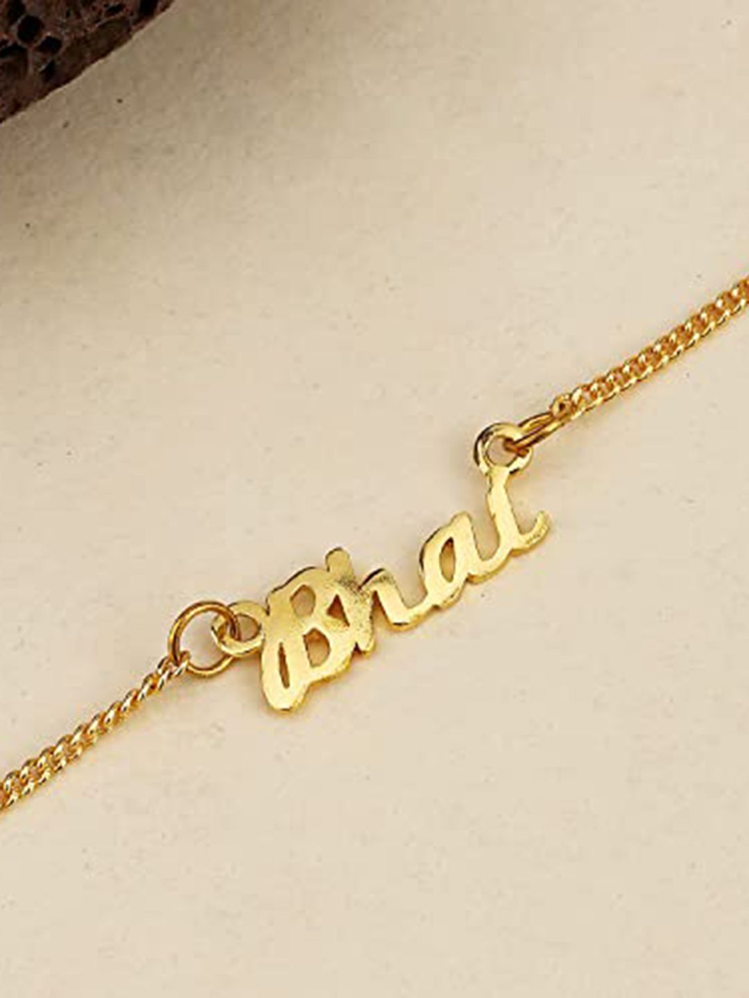 Voylla Gold-Toned Engraved with The Word 'Bhai' Rakhi Bracelet with Roli Chaawal Pack