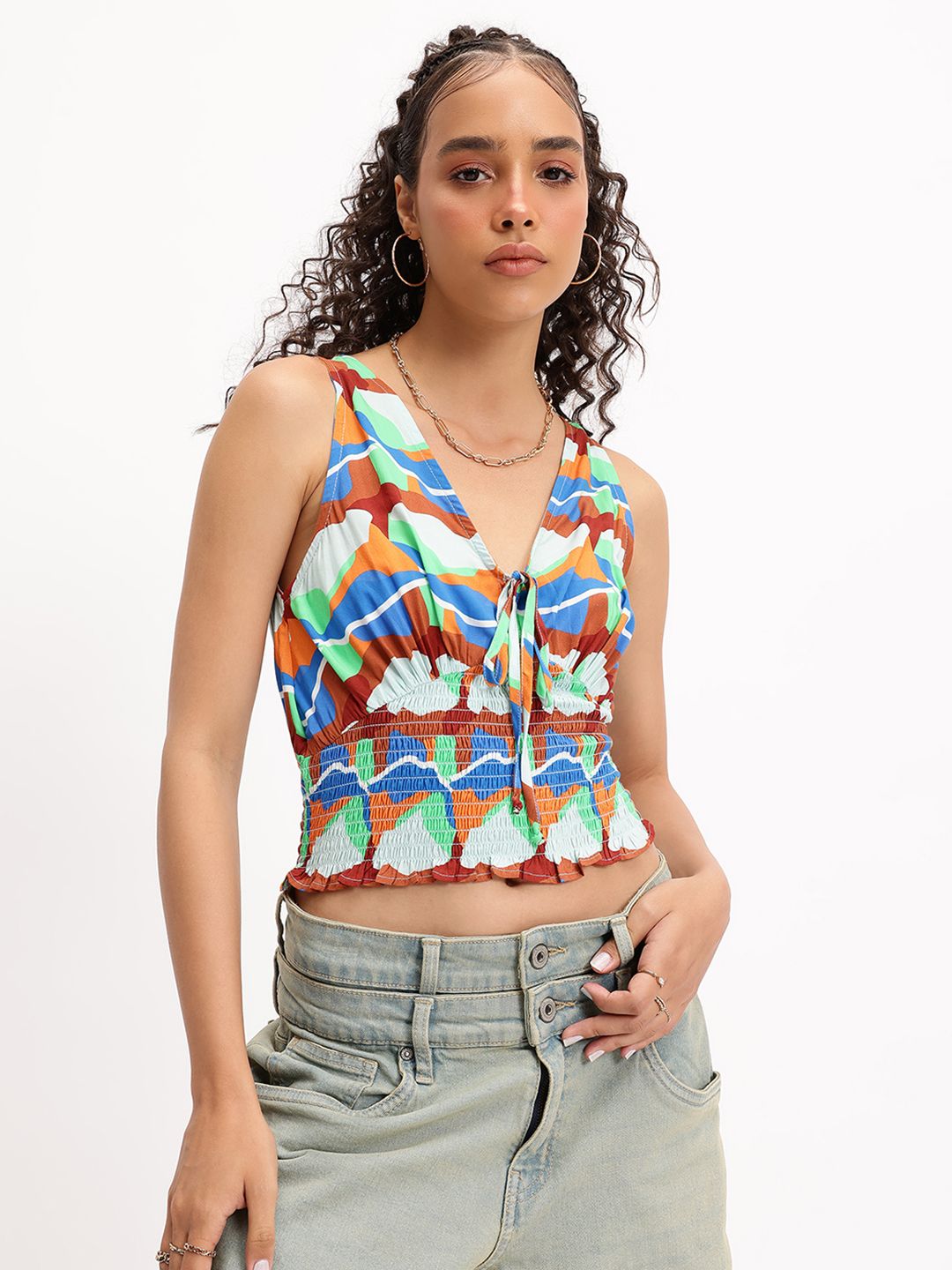 DressBerry Playful Palette  Abstract Printed Tie-Up Neck Smocked Top