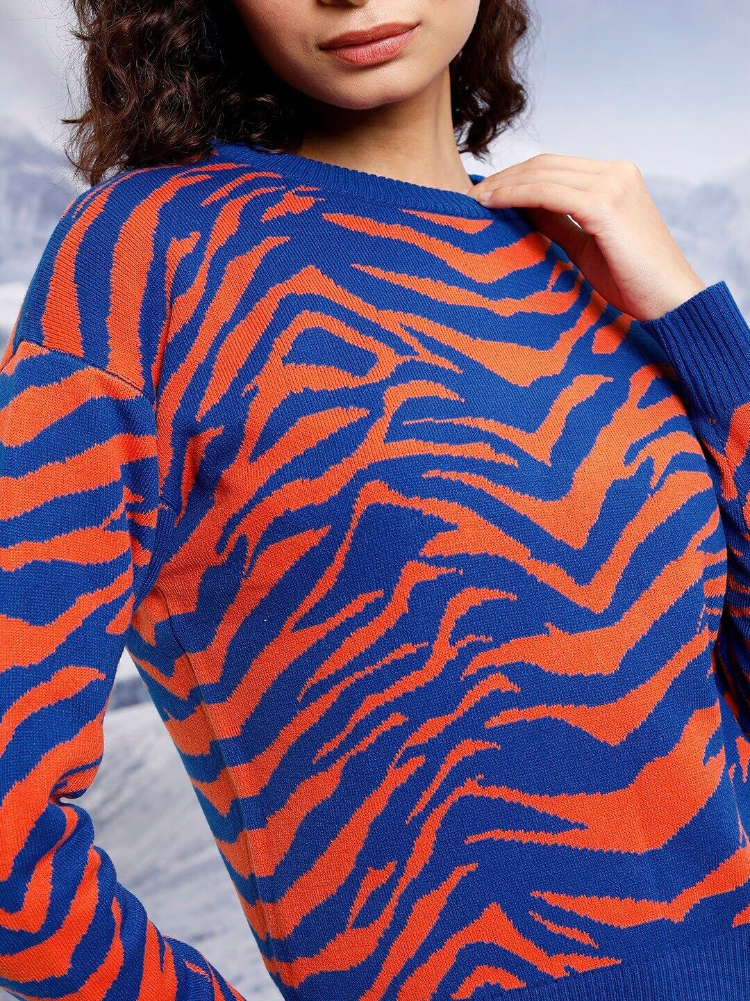 Tokyo Talkies Blue & Orange Animal Printed Acrylic Pullover Sweaters