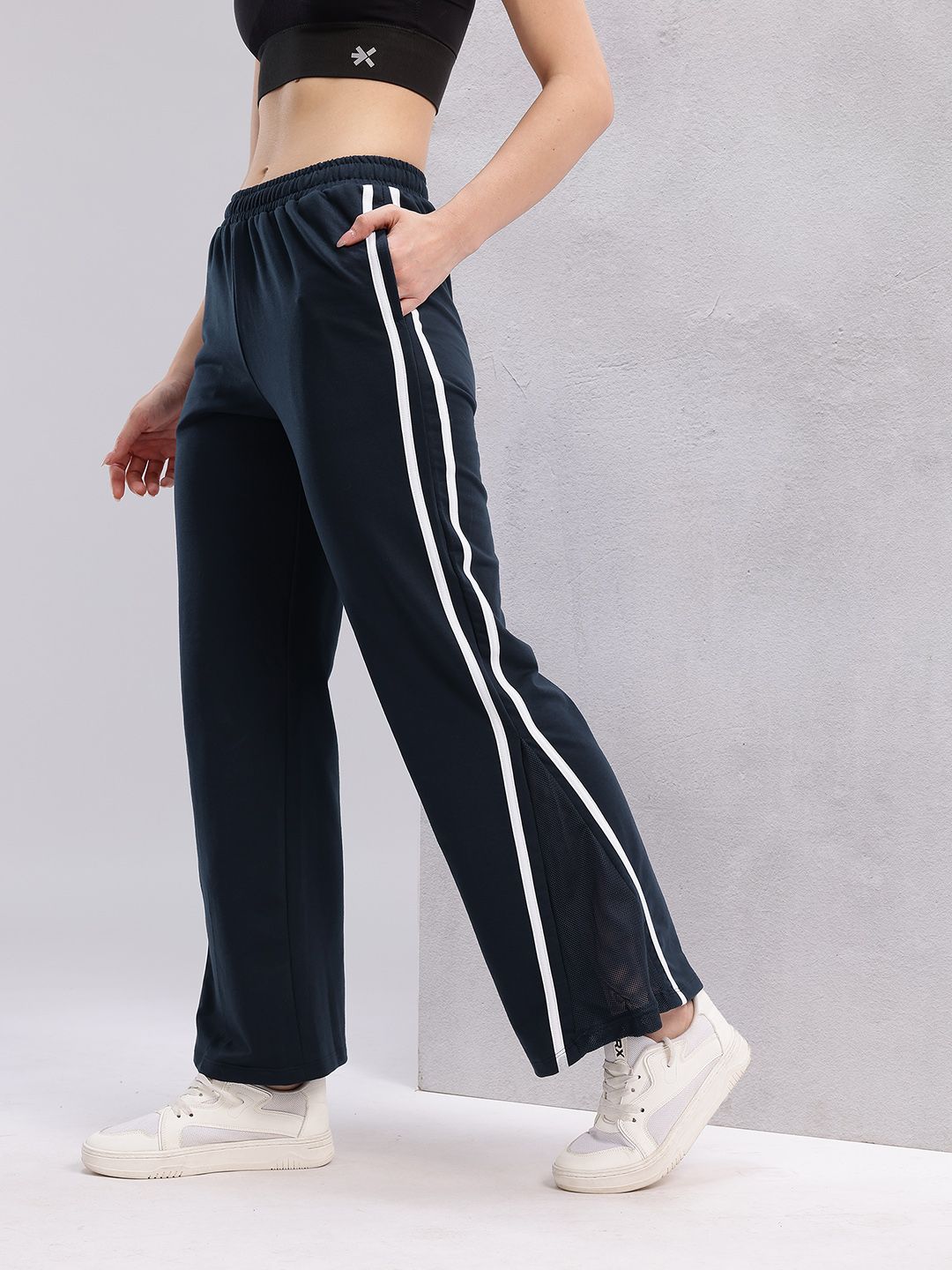 HRX by Hrithik Roshan Women Flared Fit Mesh Inserts Training Track Pants with Side Stripes