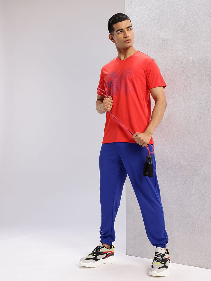 HRX oleh Hrithik Roshan Men Typography Cetak Perincian Mid-Rise Rapid-Dry Joggers