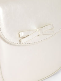 DressBerry Textured Structured Sling Bag with Bow Detail