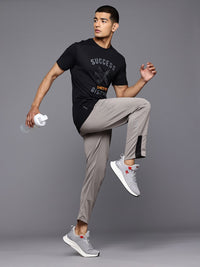 HRX by Hrithik Roshan Men Mid-Rise Regular Fit Rapid-Dry Running Track Pants