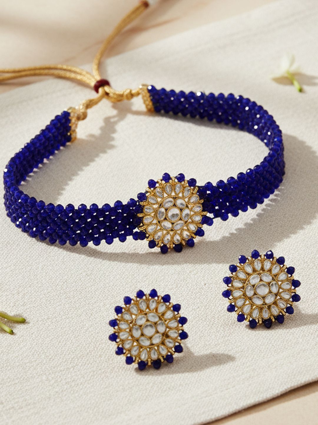 KARATCART Gold-Plated White Crystal & Kundan-Studded & Blue Beaded Handcrafted Jewellery Set