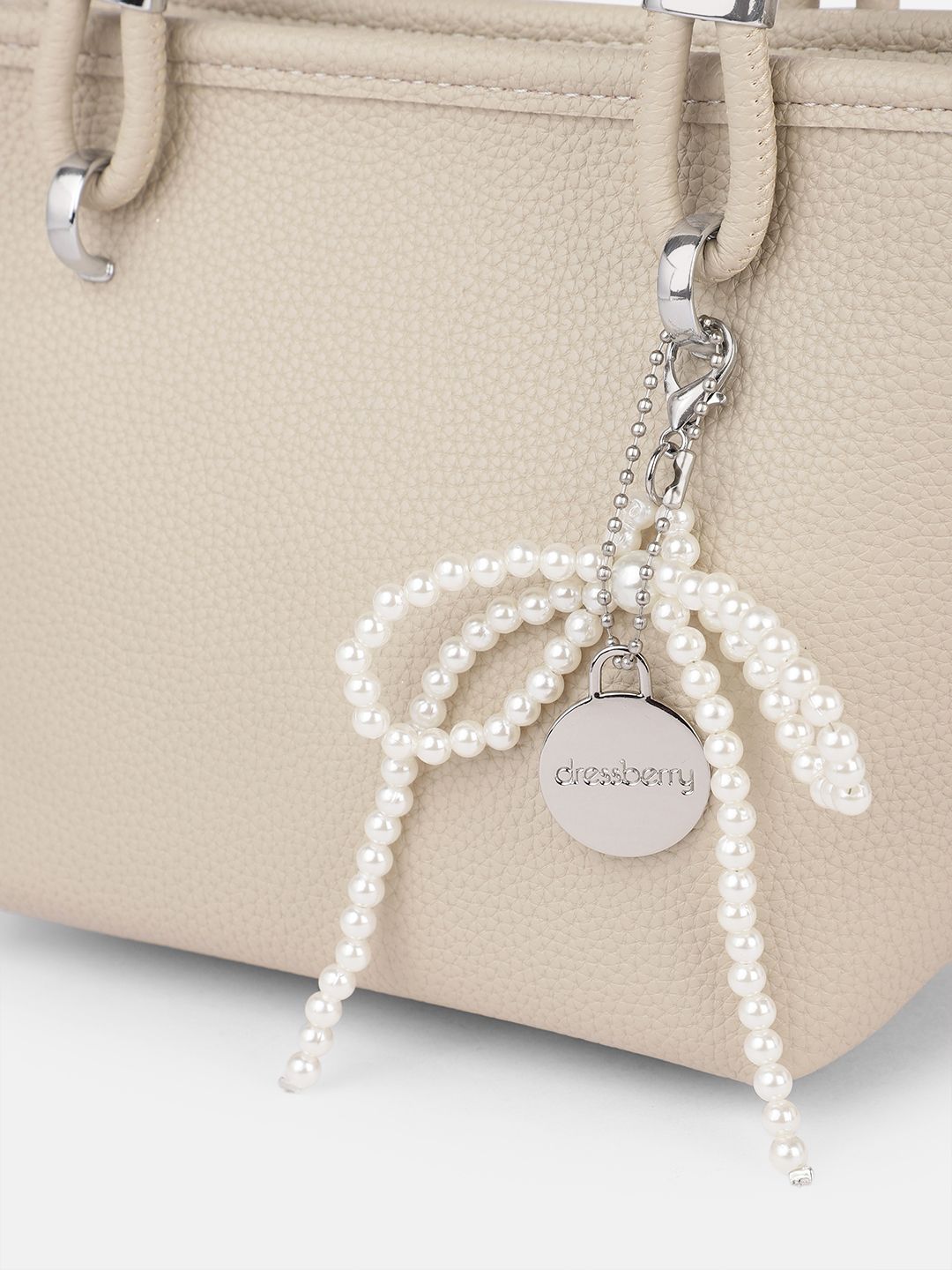 DressBerry Textured Structured Handheld Bag With Embellished